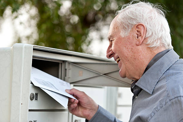 caucasian senior man receiving his mail